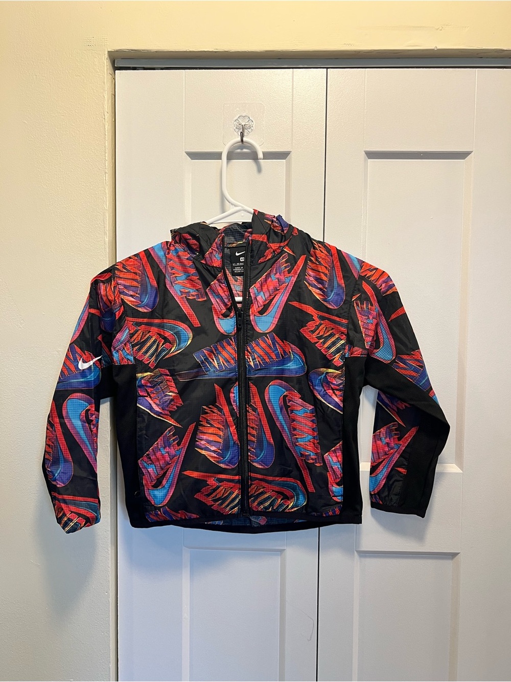 Packable Nike Kids Black Hooded Jacket with Red & Blue Multicolor Print
